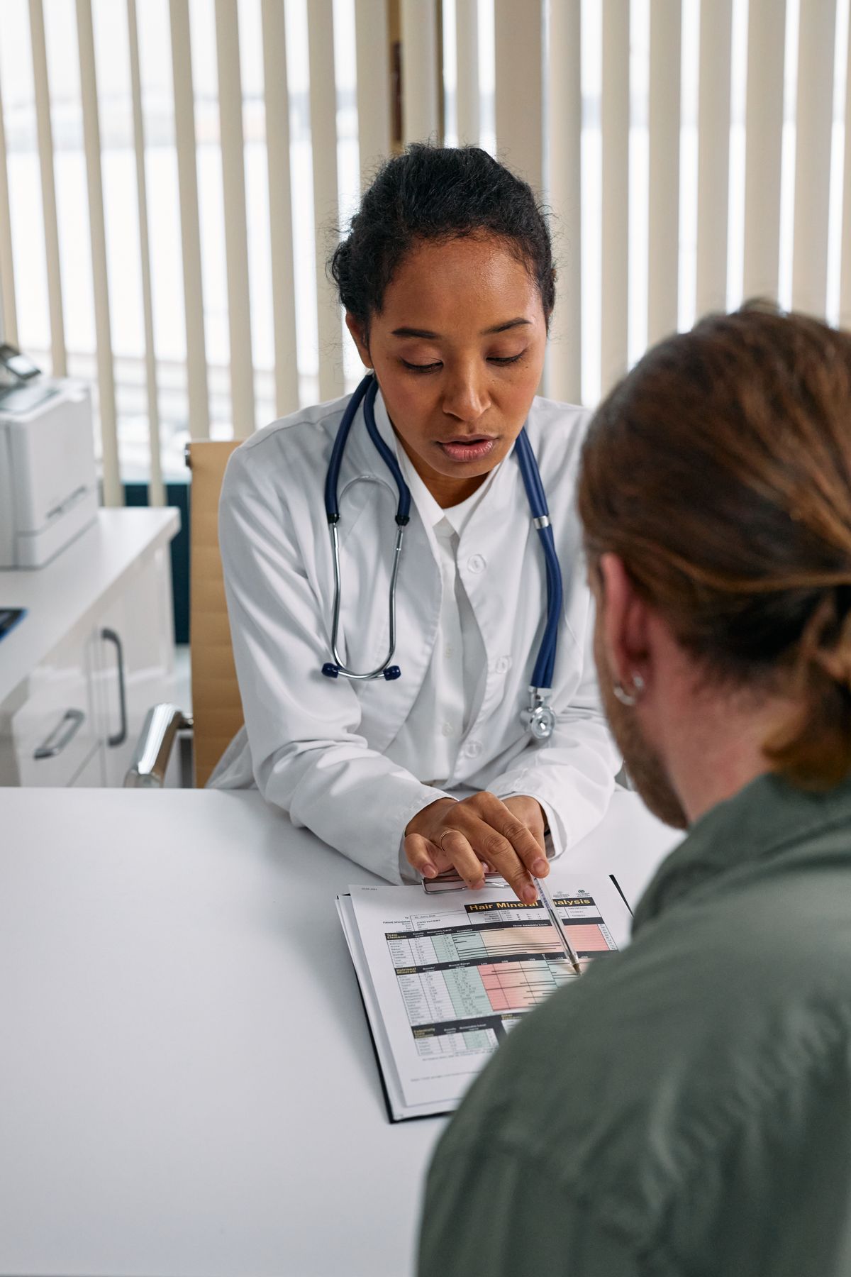 A care coordinator in consultation with a patient